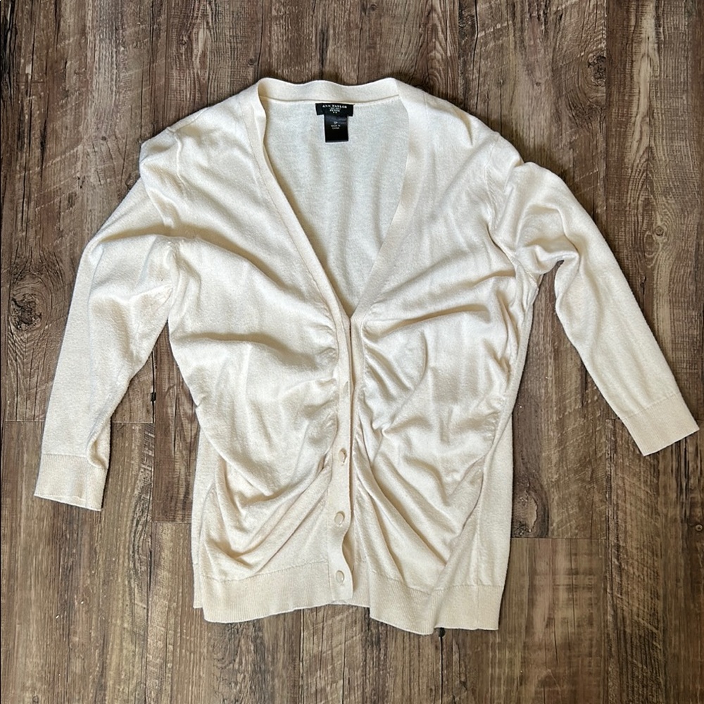 Ann Taylor Cream Cardigan with Ruched Front. Spot on right sleeve